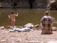 Lara Flynn Boyle's nude butt in Threesome movie (1994)